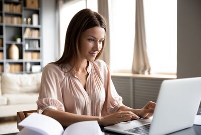 Someone typing on a laptop