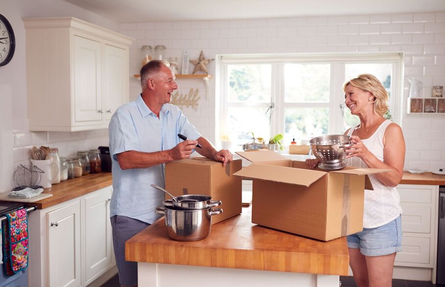 A couple packing up in their kitchen