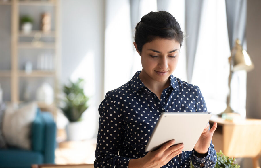 Someone holding a tablet