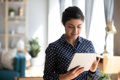 Someone holding a tablet