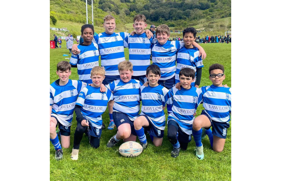 A group of boys in rugby tops with 'Lawlors' written on them