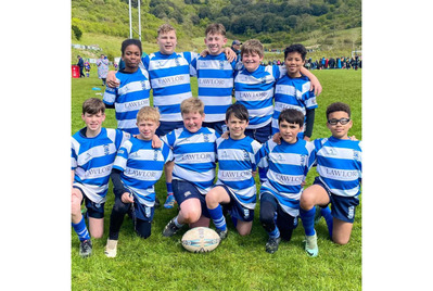 A group of boys in rugby tops with 'Lawlors' written on them