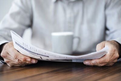 Someone reading a newspaper