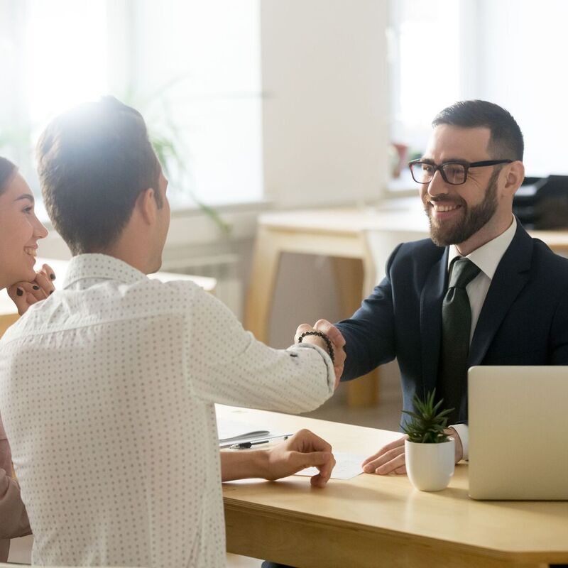 Valuation manager shaking hands with property owners