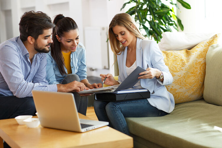 people at an appointment with mortgage adviser 