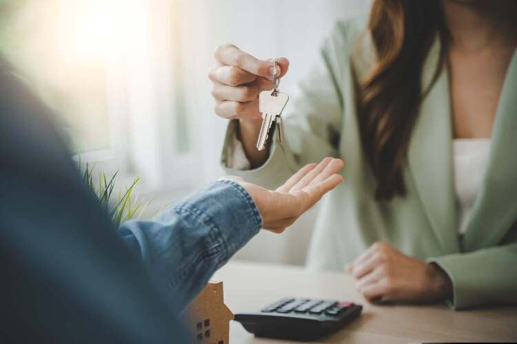 Two people exchanging keys