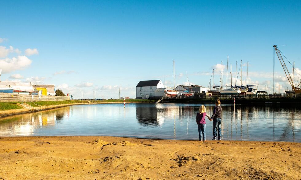 Boy and girl at the river mouth