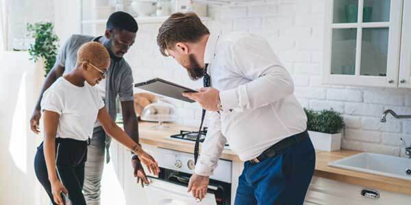 Inspecting oven in rented kitchen