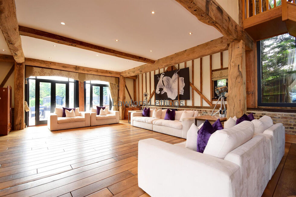 Beautiful spacious barn with white couches