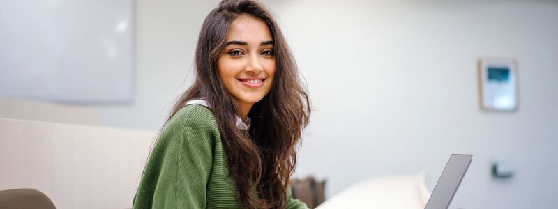 Happy lady on a computer