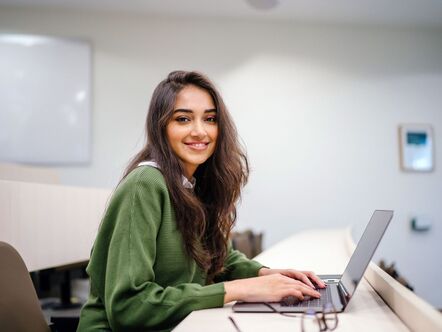 Happy lady on a computer