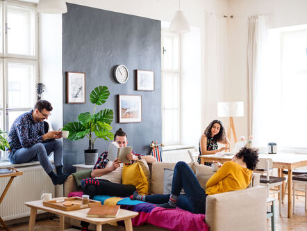 Friends relaxing in shared house 