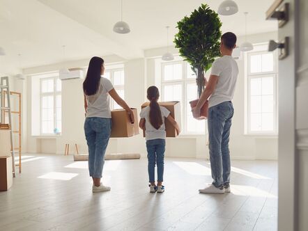 Family with moving in boxes